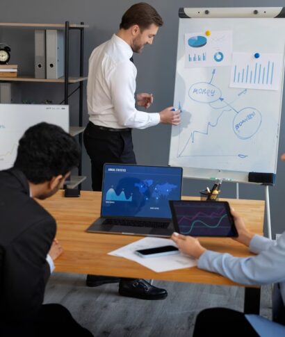 business-person-looking-finance-graphs_23-2150461327 business-person-looking-finance-graphs_23-2150461327